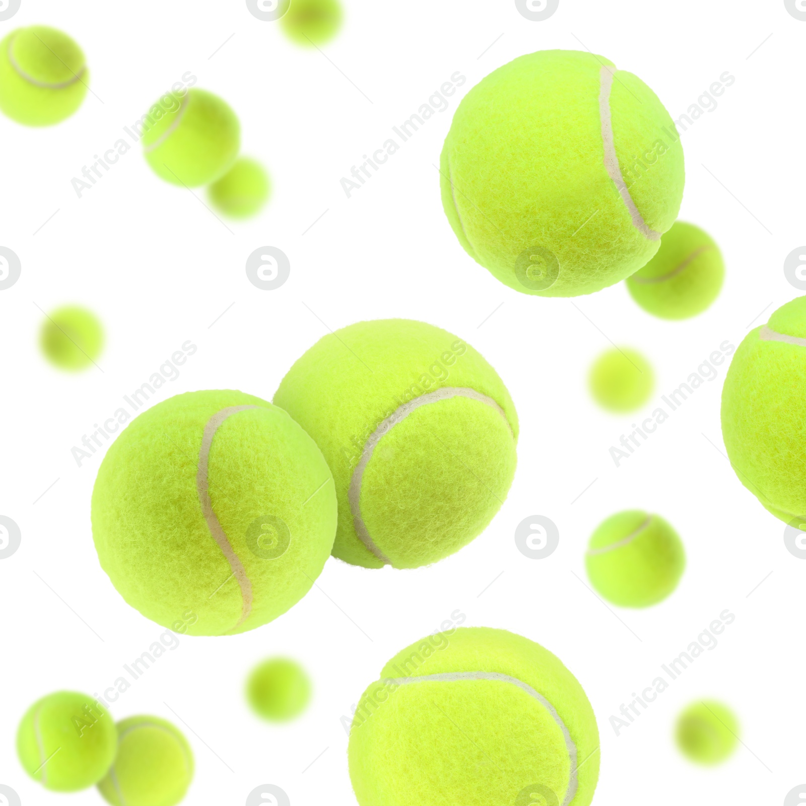 Image of Many bright tennis balls in air on white background