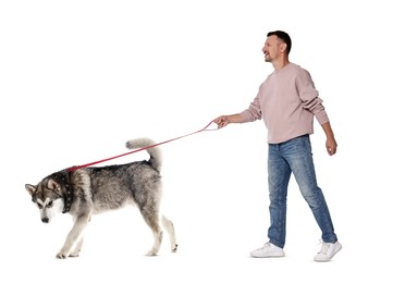 Happy man walking his dog on white background