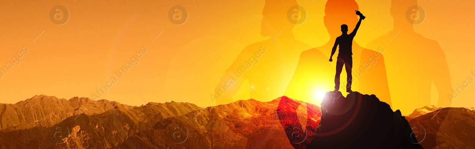 Image of Winner with trophy cup in mountains at sunrise and silhouettes of people. Banner design