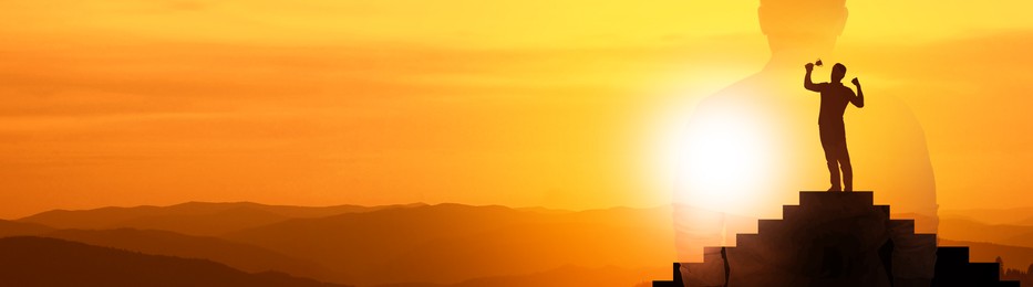 Winner with trophy cup on podium in mountains at sunrise and silhouette of man. Banner design