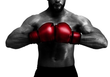 Image of Man in red boxing gloves on white background, closeup. Black-and-white effect with color accent