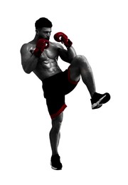 Man in red boxing gloves training on white background. Black-and-white effect with color accent