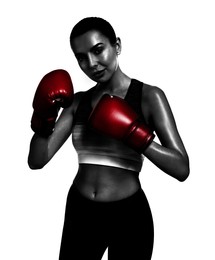 Image of Woman in red boxing gloves on white background. Black-and-white effect with color accent