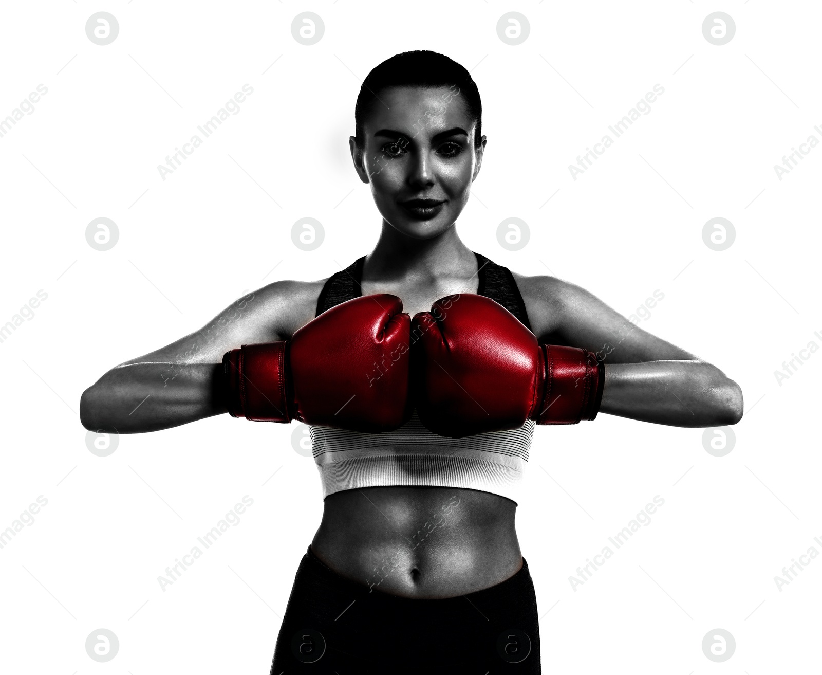 Image of Woman in red boxing training on white background. Black-and-white effect with color accent