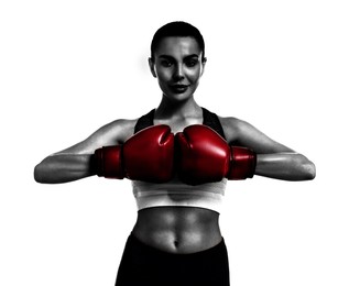 Woman in red boxing training on white background. Black-and-white effect with color accent