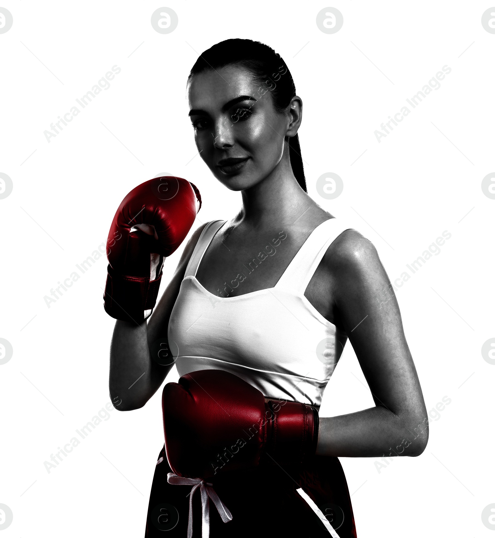 Image of Woman in red boxing gloves on white background. Black-and-white effect with color accent