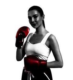 Woman in red boxing gloves on white background. Black-and-white effect with color accent