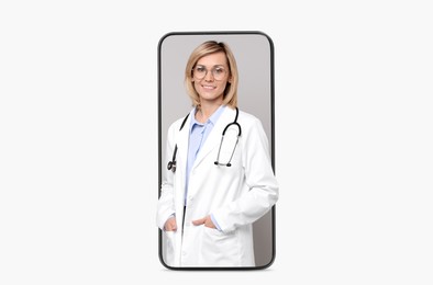 Online medical consultation. Doctor on smartphone screen against white background