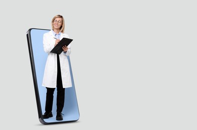 Online medical consultation. Doctor with clipboard on smartphone screen against light grey background, space for text