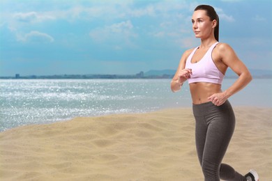 Image of Beautiful woman running on beach. Space for text