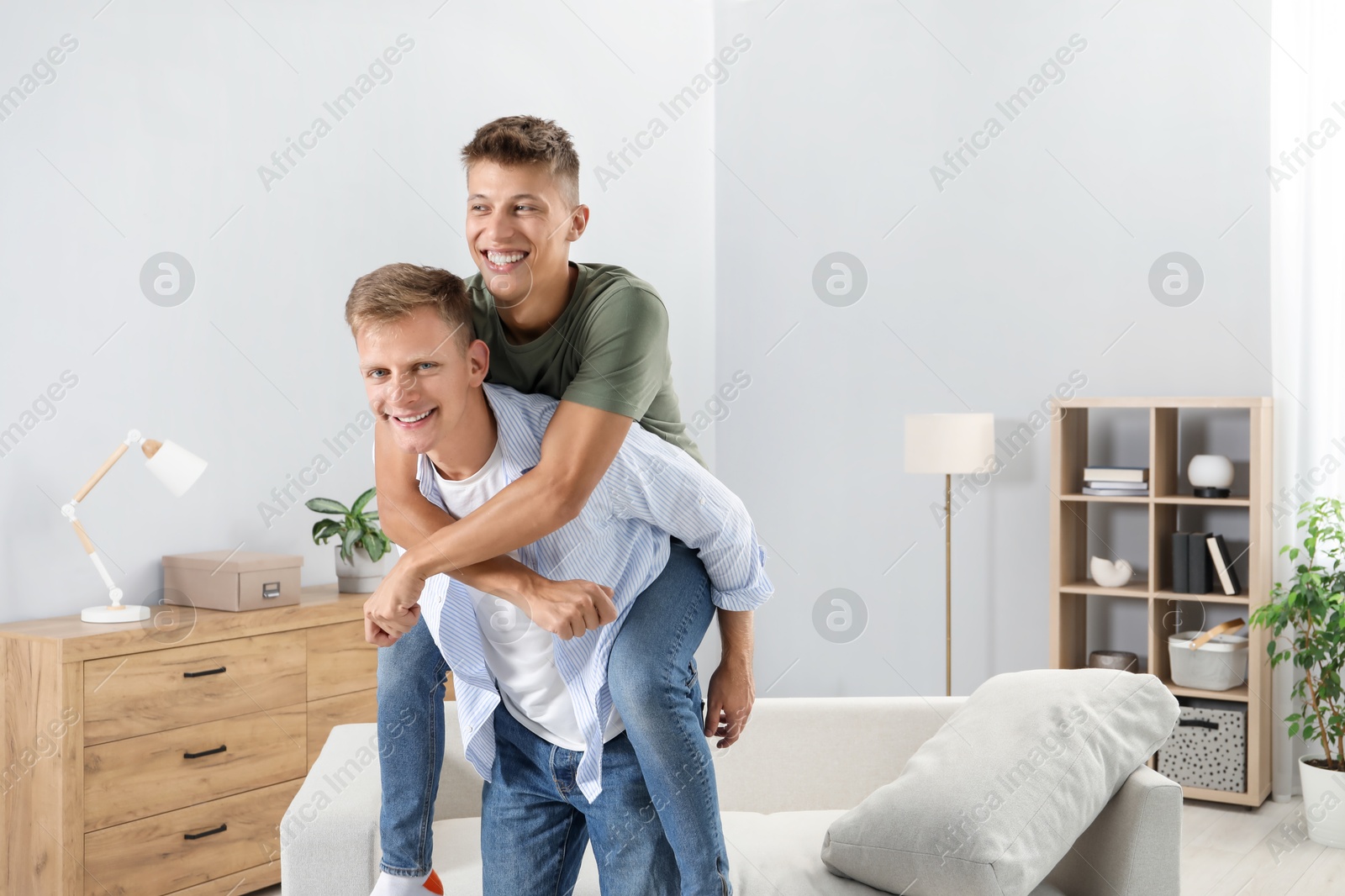 Photo of Happy brothers spending time together at home