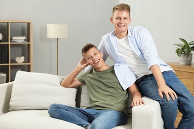 Happy brothers spending time together at home. Space for text