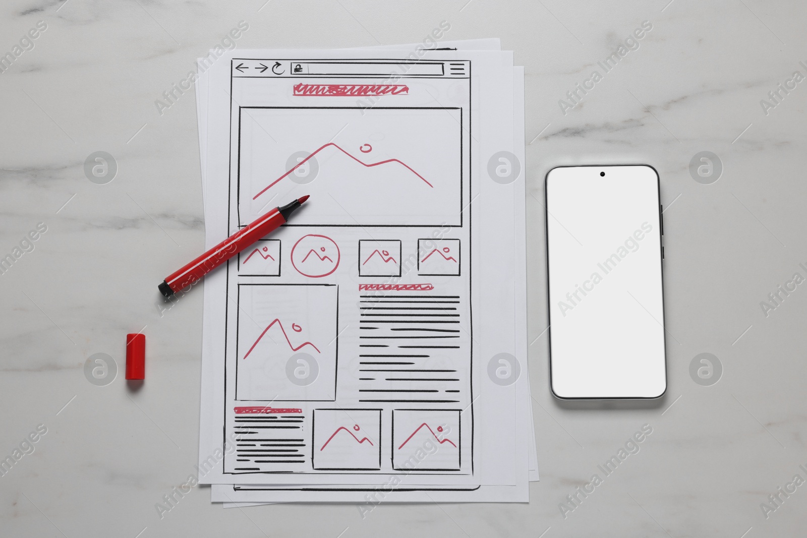 Photo of Developing UI design. Sketches of website wireframes, smartphone and felt pen on white marble table, top view