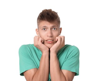 Portrait of scared young man on white background