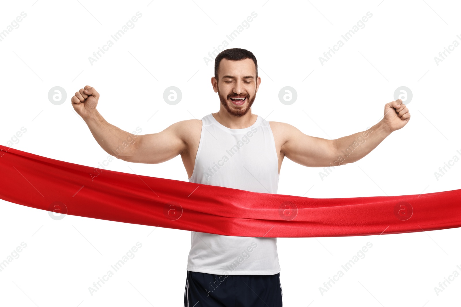 Photo of Handsome young man crossing red finish line on white background