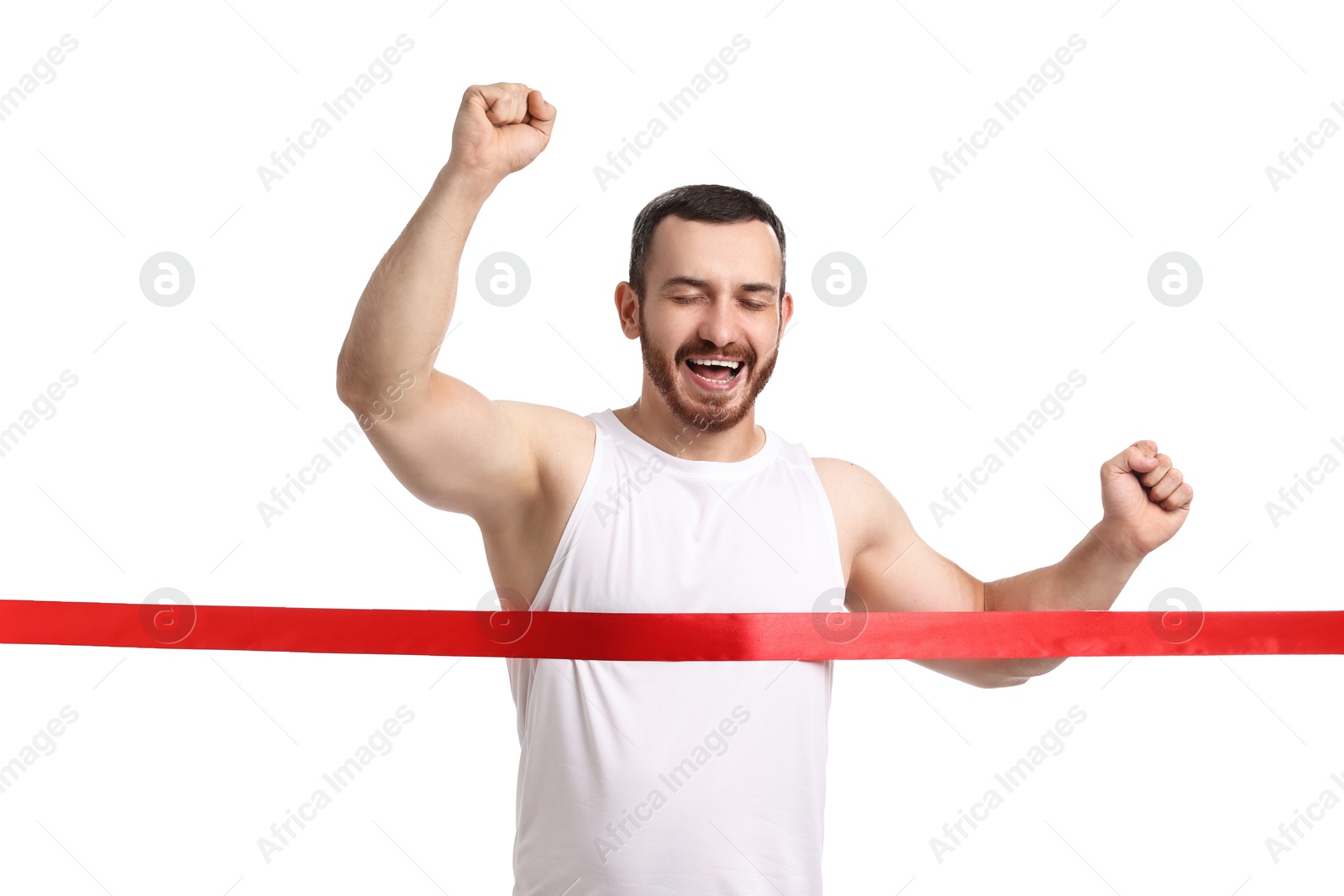 Photo of Handsome young man crossing red finish line on white background