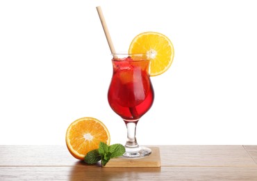 Photo of Glass of tasty refreshing drink with straw and fresh fruit on wooden table against white background