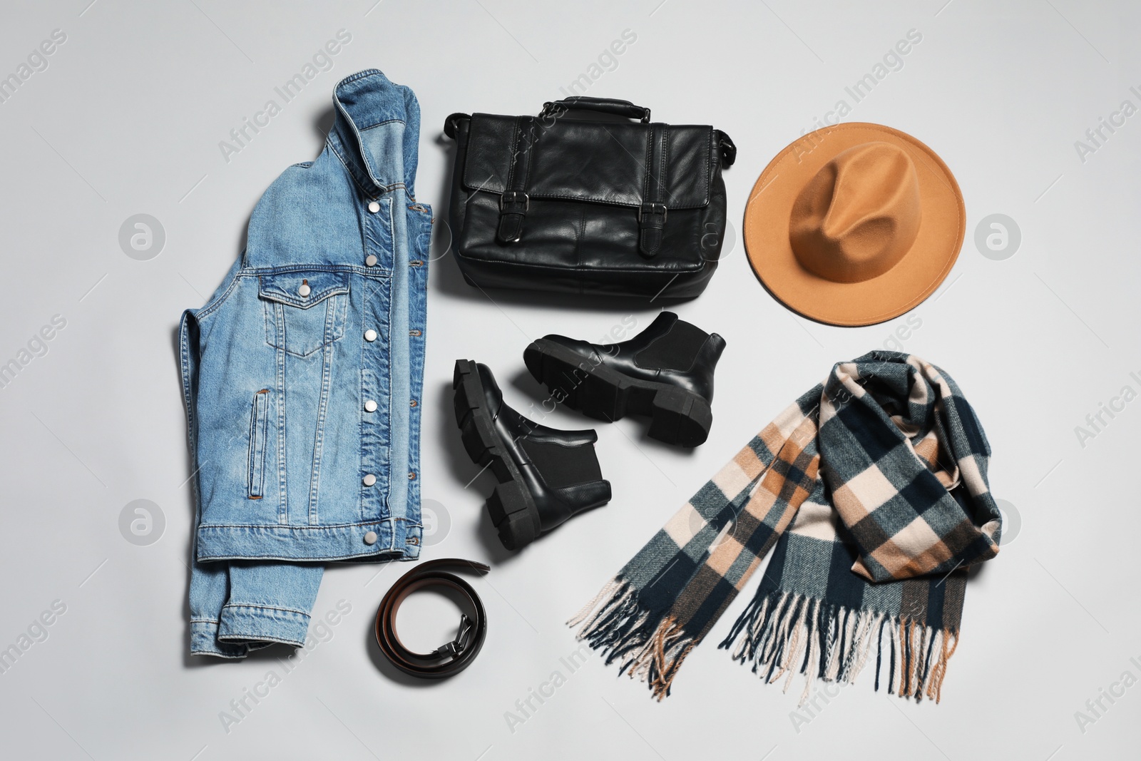 Photo of Stylish outfit with briefcase on light grey background, flat lay