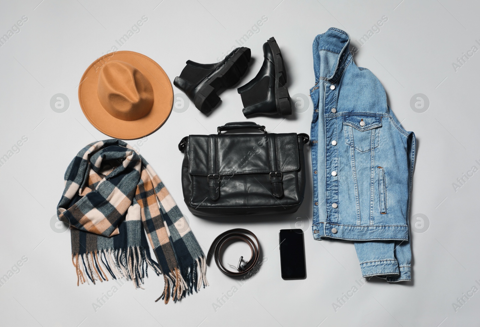 Photo of Stylish outfit with briefcase on light grey background, flat lay