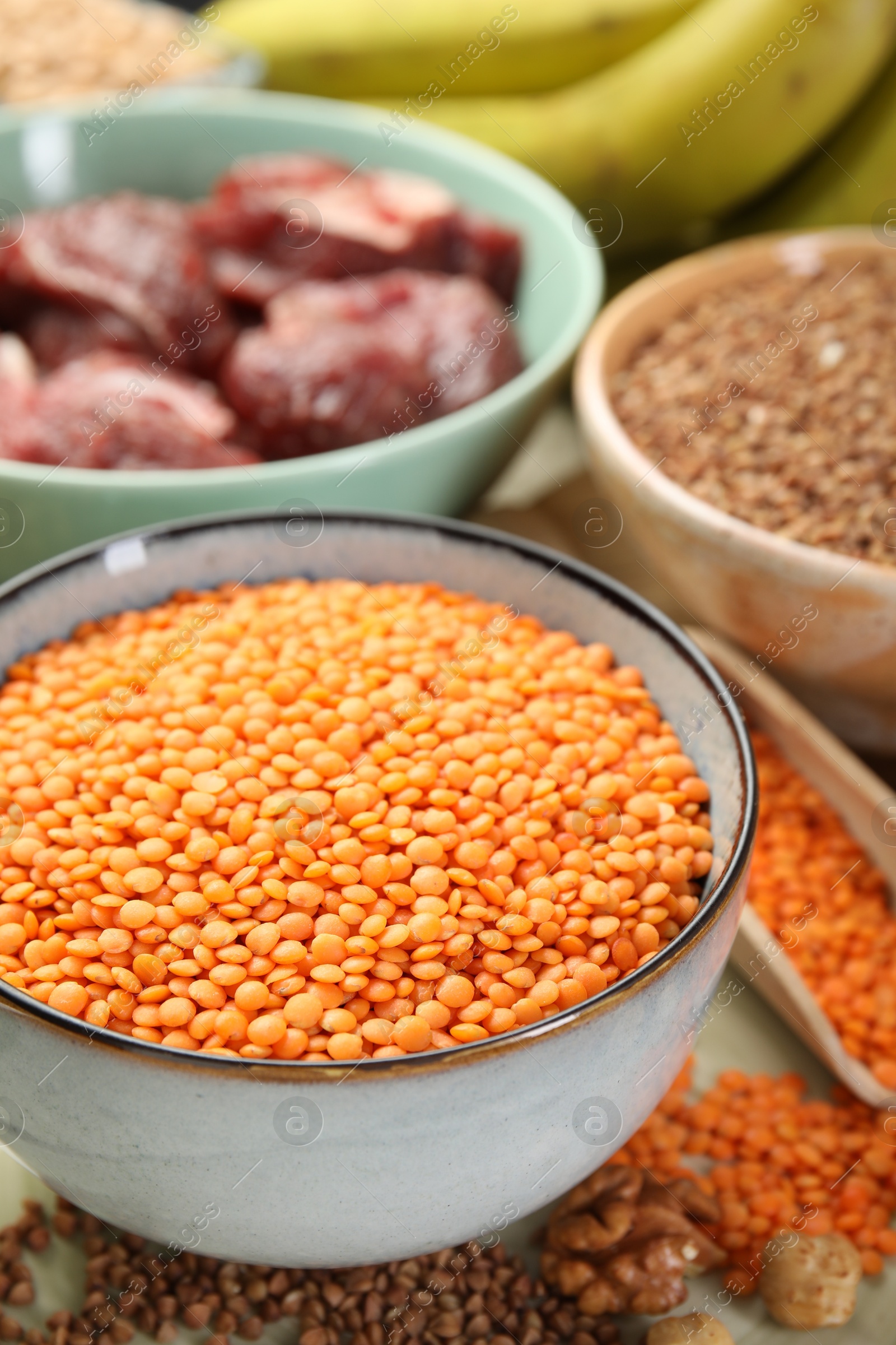 Photo of Different products rich in iron on table, closeup. Diet plan for anemia