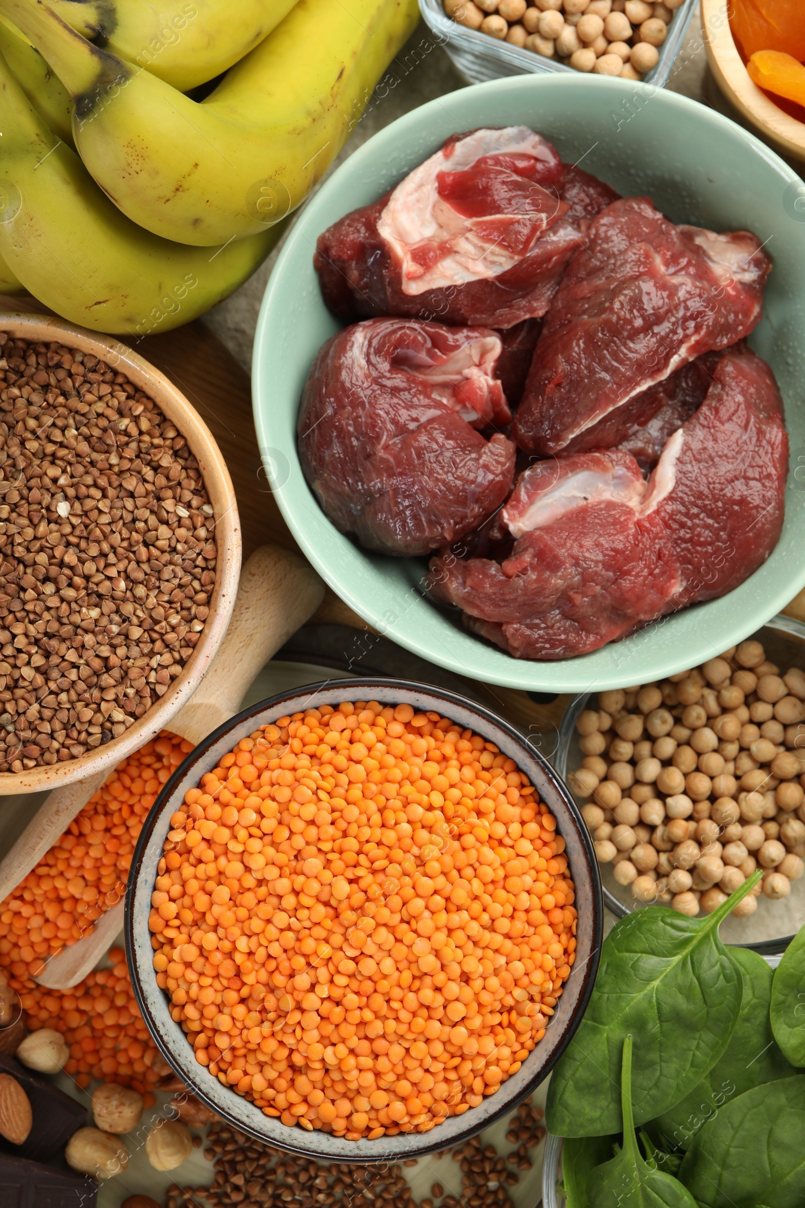 Photo of Different products rich in iron on table, flat lay. Diet plan for anemia