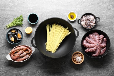 Photo of Ingredients for wok on grey table, flat lay