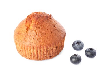 Photo of Delicious sweet muffin and blueberries isolated on white