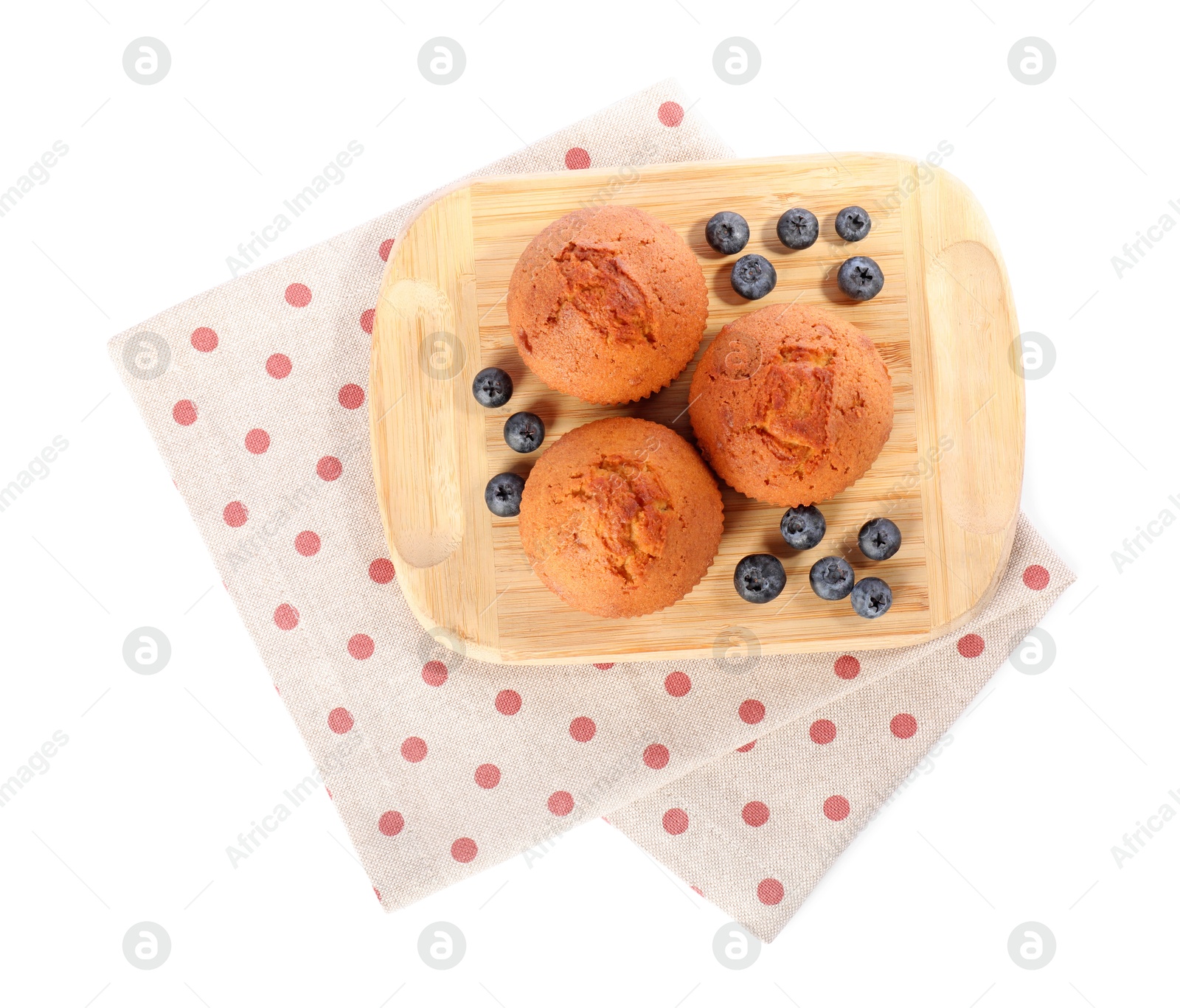 Photo of Delicious sweet muffins and blueberries isolated on white, top view