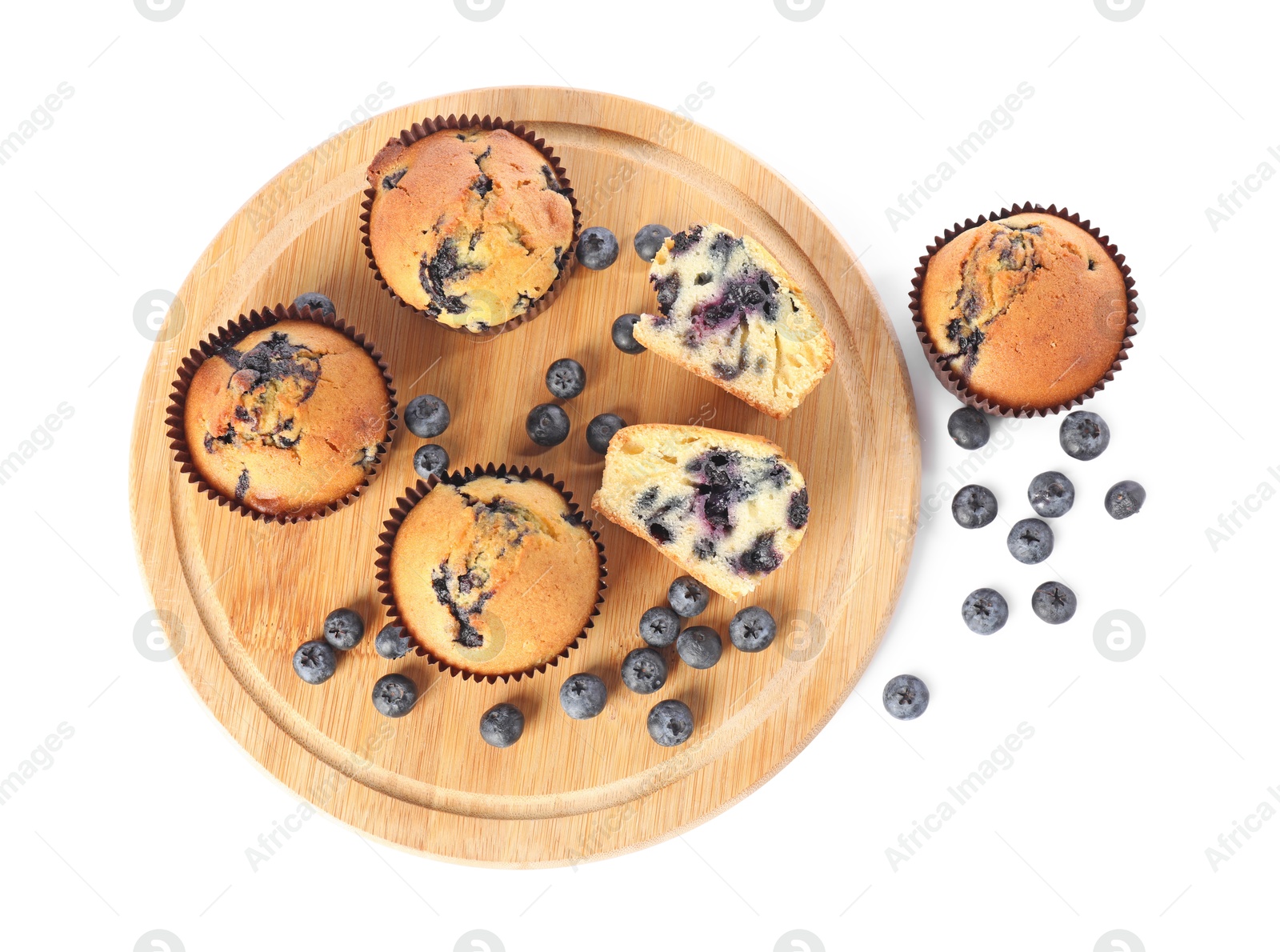 Photo of Delicious sweet muffins with blueberries isolated on white, top view