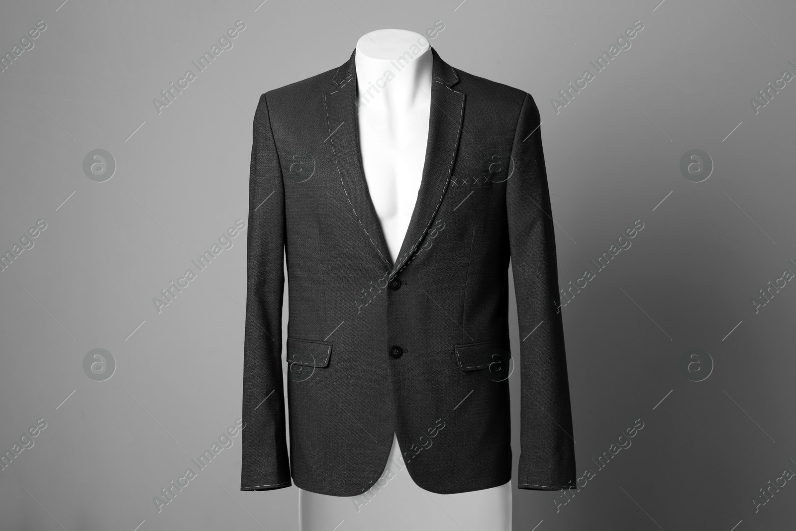 Photo of Semi-ready jacket on male mannequin against grey background