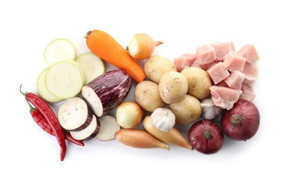 Photo of Uncooked ingredients for stew isolated on white, top view