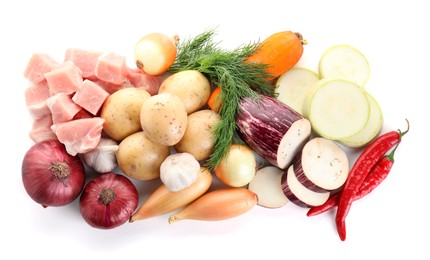 Photo of Uncooked ingredients for stew isolated on white, top view