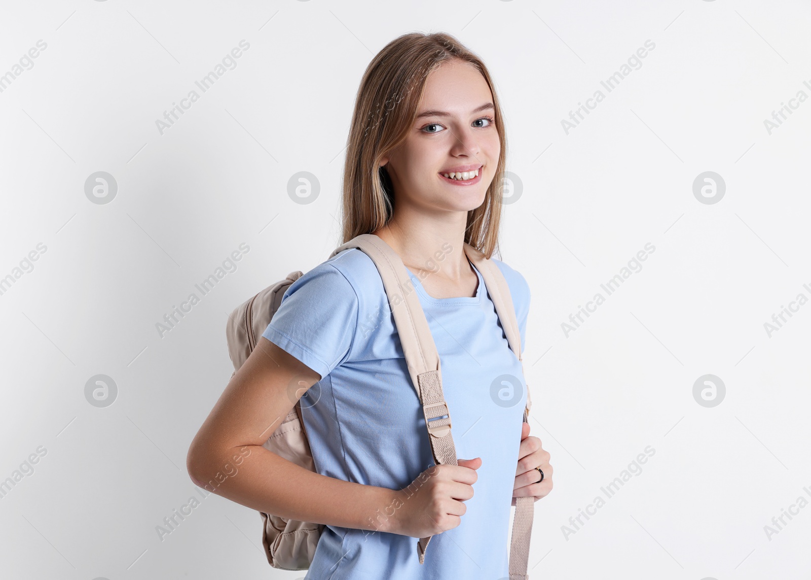 Photo of Teenage girl with backpack on white background