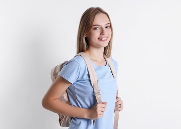 Photo of Teenage girl with backpack on white background