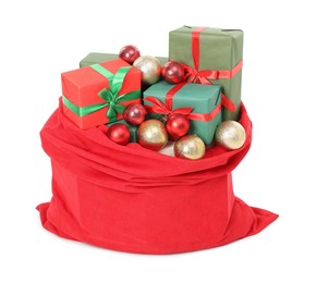 Photo of Santa Claus bag full of presents and decorative balls isolated on white