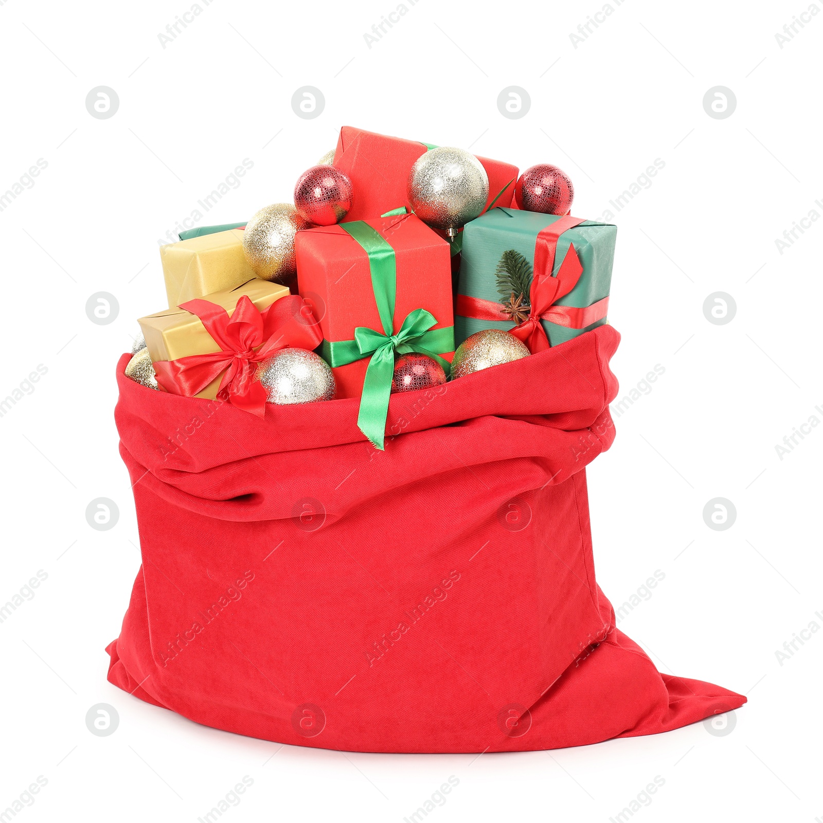 Photo of Santa Claus bag full of presents and decorative balls isolated on white