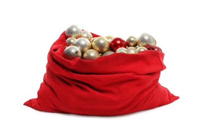 Photo of Red Santa Claus bag with baubles isolated on white