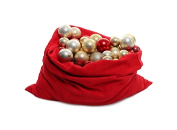 Photo of Red Santa Claus bag with baubles isolated on white