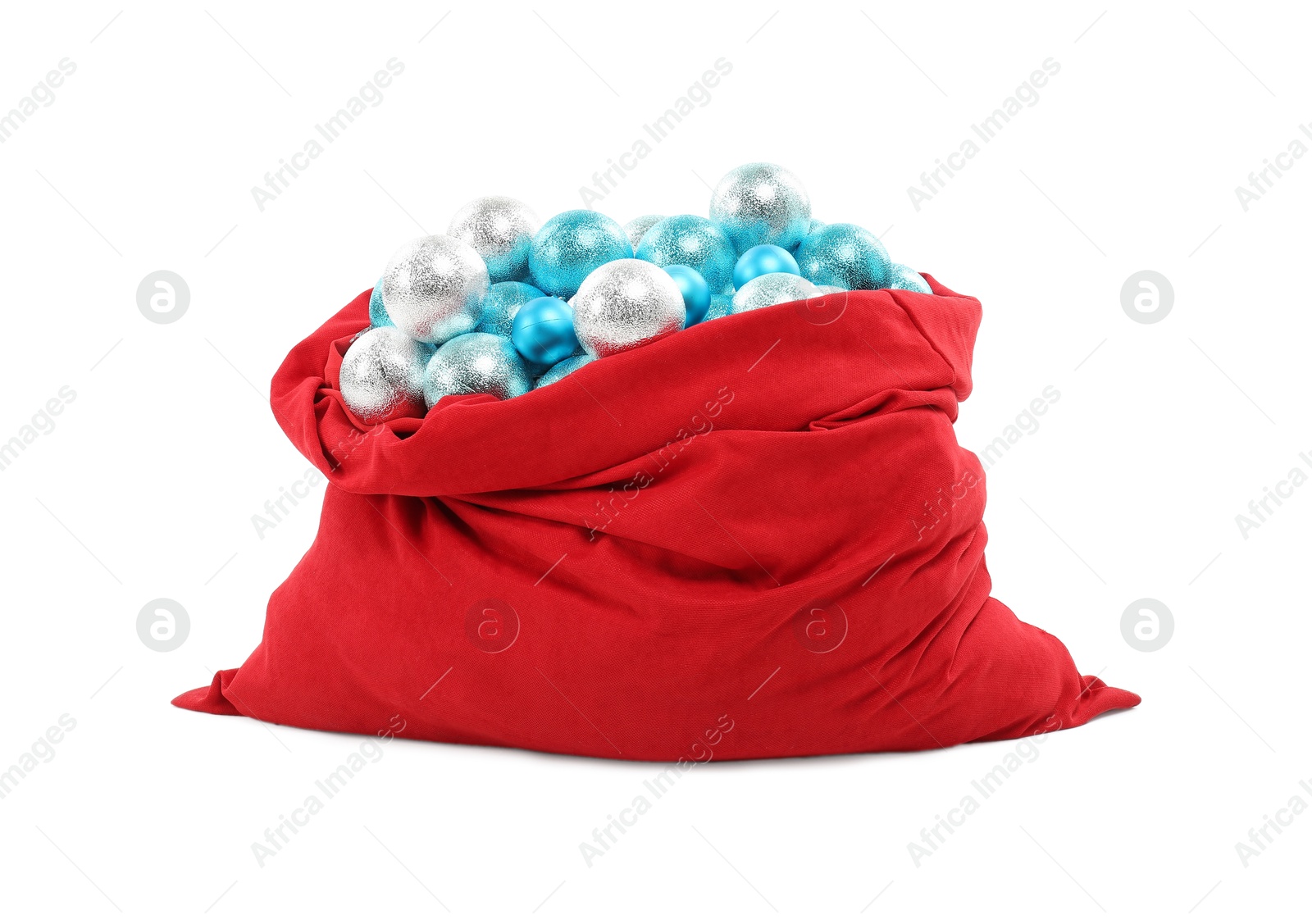 Photo of Red Santa Claus bag with baubles isolated on white