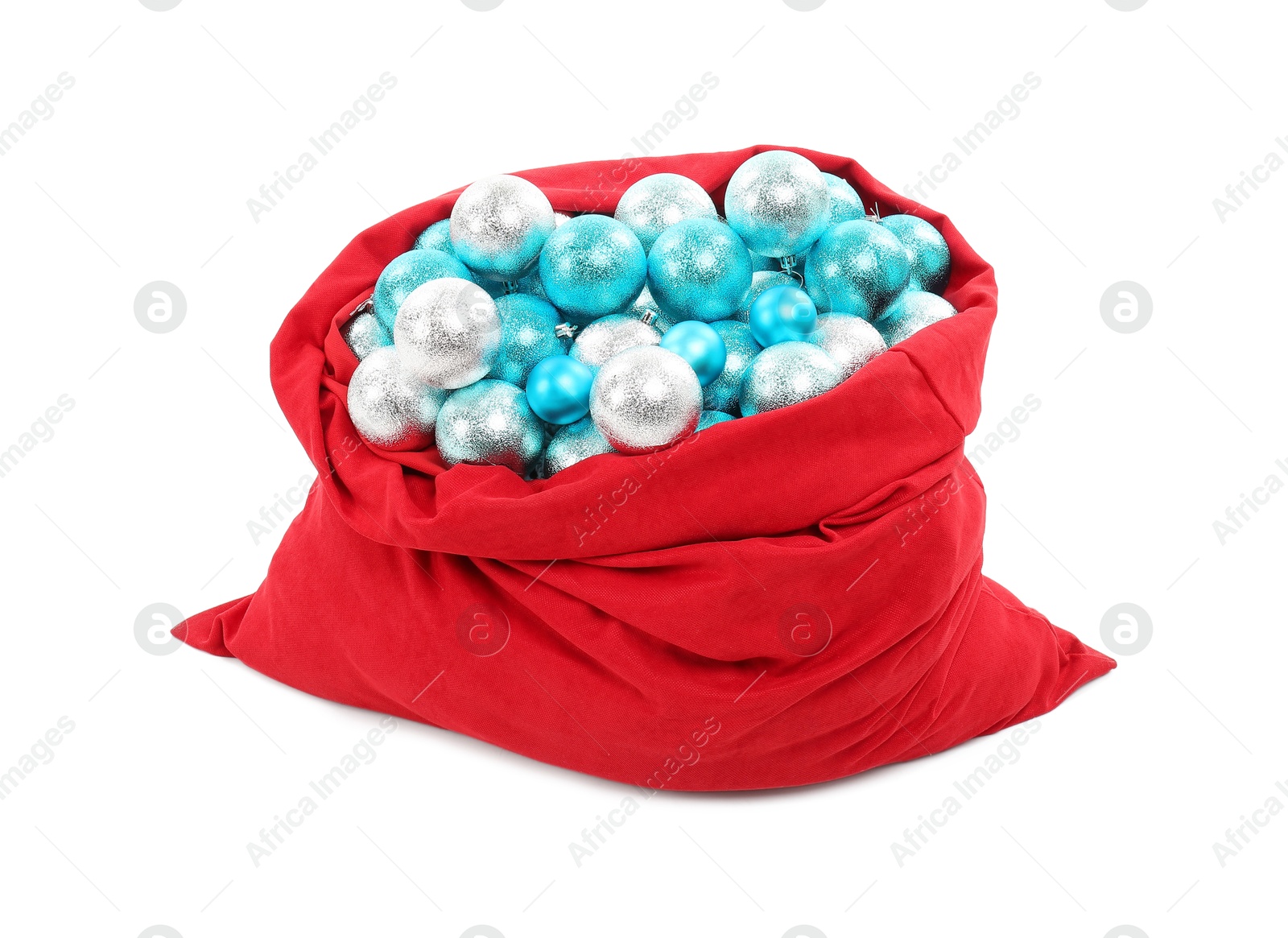 Photo of Red Santa Claus bag with baubles isolated on white