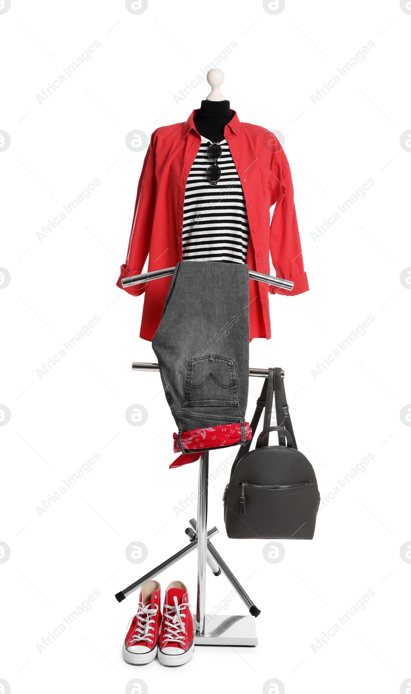 Photo of Female mannequin with stylish outfit, backpack and red sneakers isolated on white