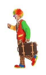 Emotional clown with suitcase on white background