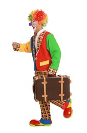 Happy clown with suitcase on white background