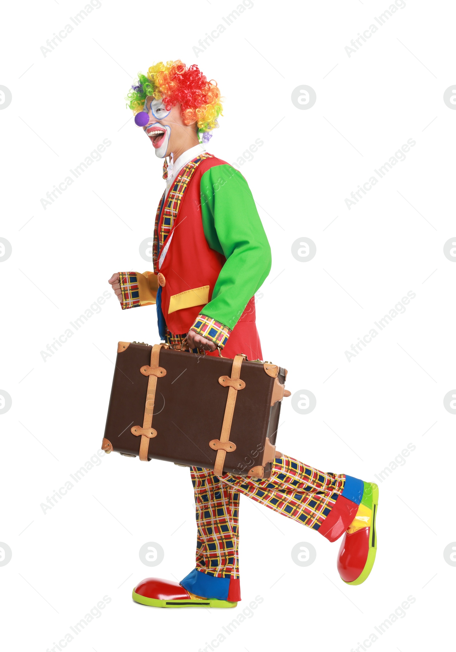 Photo of Happy clown with suitcase on white background