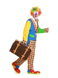 Happy clown with suitcase on white background