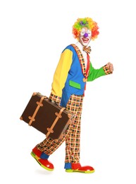 Happy clown with suitcase on white background