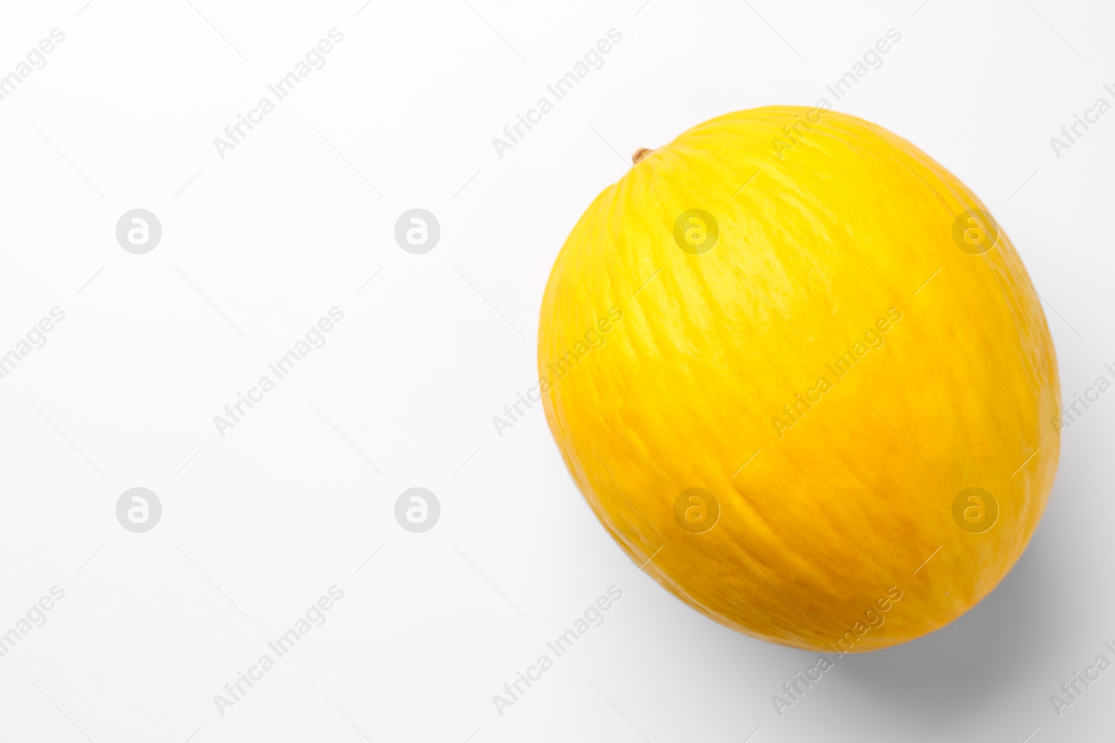 Photo of One fresh melon on white background, top view. Space for text