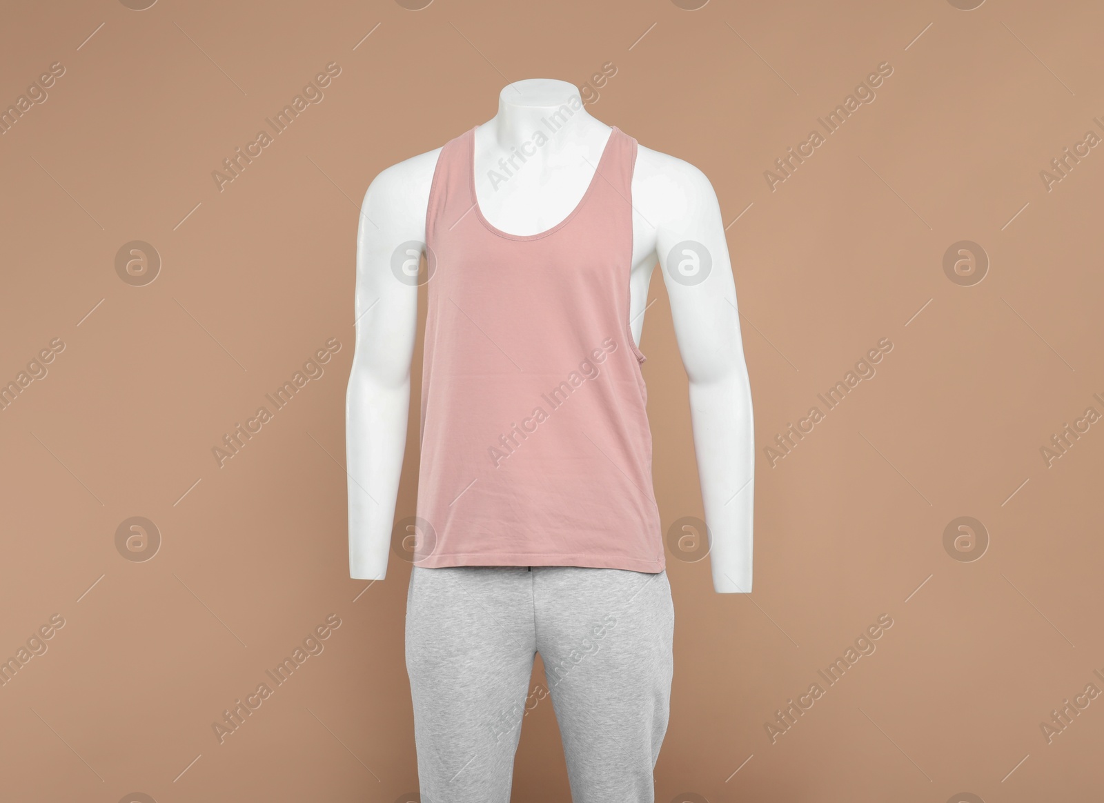 Photo of Male mannequin with stylish sportswear on beige background