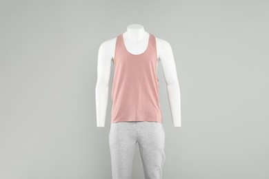 Photo of Male mannequin with stylish sportswear on light background