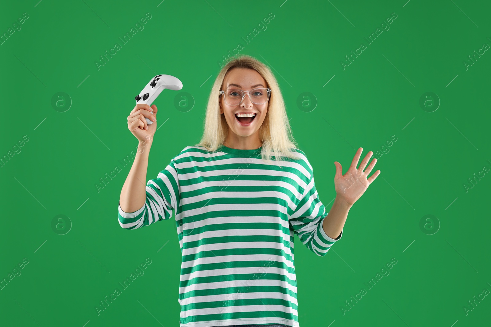 Photo of Happy woman with controller on green background